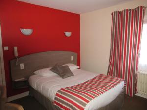 Postel nebo postele na pokoji v ubytování Logis Hôtel Andreinia & Cabanes