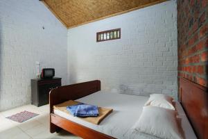 Cama ou camas em um quarto em Katumbiri Resort
