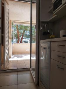 Kuchyň nebo kuchyňský kout v ubytování Apartmani Vrančić