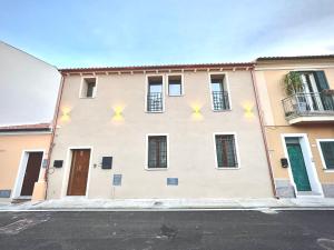 a building with stars on the side of it at Waterfront apartment Olbia in Olbia