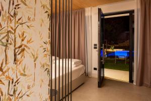 Postel nebo postele na pokoji v ubytování Relais Limonaia - Suites & Garden SPA
