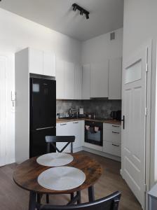 Kuchyňa alebo kuchynka v ubytovaní Pistacjowy - Apartamenty Smart Projekt