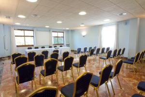 a room with a table and chairs in it at Hotel Torques in A Coruña