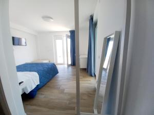 A bed or beds in a room at Dolce Dimora Charme Mare