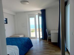 A bed or beds in a room at Dolce Dimora Charme Mare