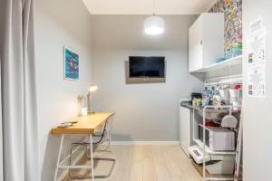 a small kitchen with a desk and a refrigerator at Sunny Beach Bari in Bari