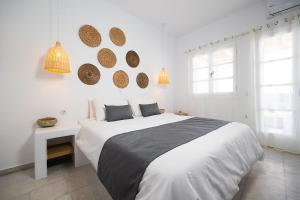 Posteľ alebo postele v izbe v ubytovaní Kalypso Vacation Home Naxos Town
