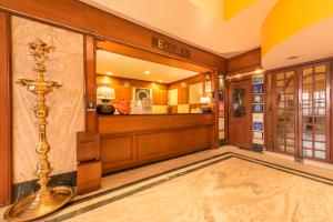 a lobby of a building with a waiting room at Bangalore Gate Hotel & Conferences in Bangalore