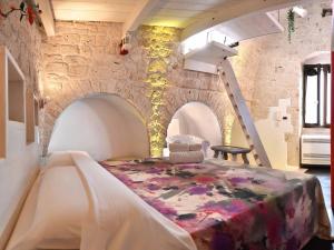 Postel nebo postele na pokoji v ubytování L'Angolo di Gaudì, casa Milà