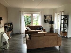Posezení v ubytování Vakantiewoning de Kei. Modern Achterhoeks genot