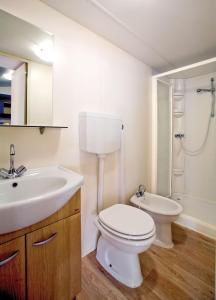 a bathroom with a toilet and a sink and a shower at Camping Villaggio Santa Maria Di Leuca in Gagliano del Capo