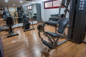 a gym with several tread machines in a room at Hotel Acacias Suites & Spa in Lloret de Mar