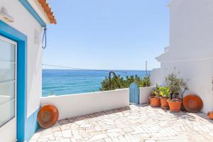 a balcony with a view of the ocean at B54 - Casa Azul in Burgau in Budens