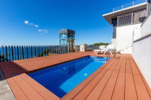 a swimming pool on the deck of a house at RNET - Casa 3 - Vista Mar Almadrava Roses in Roses