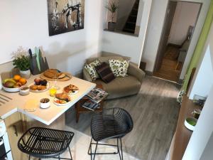a living room with a table with food on it at cosy quiet 1 bedroom apartment Carrington in Nottingham