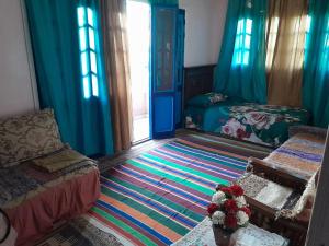 a bedroom with a bed and a large rug at Rural Guest House فندق البيت الريفي in Tanta