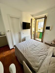 Letto o letti in una camera di Casa Cibrario - vicino Porta Susa F.S.