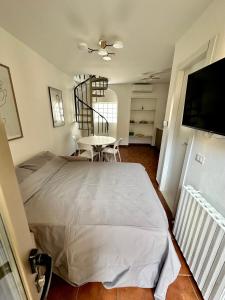 Letto o letti in una camera di Casa Cibrario - vicino Porta Susa F.S.