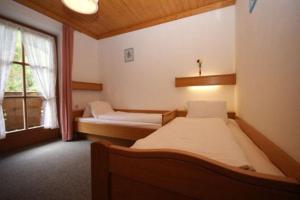 Кровать или кровати в номере Appartementhaus Bergblick