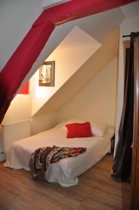 a bedroom with a bed in an attic at Le Vieux Carré in Rouen