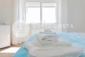 Ένα ή περισσότερα κρεβάτια σε δωμάτιο στο L'Ormeggio +50 φωτογραφίες