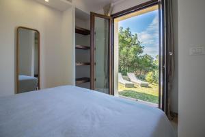 Ένα ή περισσότερα κρεβάτια σε δωμάτιο στο Villaggio Sa Luna Country Apt with Garden&Parking! +19 φωτογραφίες