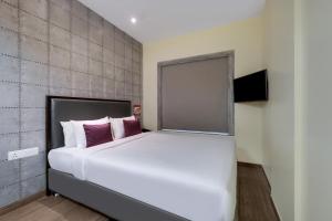7 Apple Hotel, Vadodara客房内的一张或多张床位