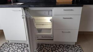 Kuchyň nebo kuchyňský kout v ubytování Apartment Curly