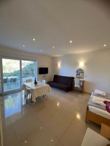a living room with a couch and a table at Brela Beachfront in Brela