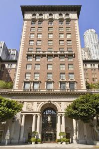 a tall brick building with a large entrance to it at The Biltmore Los Angeles in Los Angeles