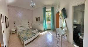 a bedroom with a bed and a sink and a mirror at Hotel Pisa in Rome