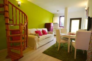 a living room with a couch and a table at Apartments Villa Rossella 3 in Rovinj