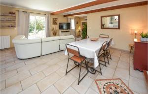 a kitchen and dining room with a table and chairs at Cozy Home In Méjannes-Lès-Alès in Méjannes-lès-Alès