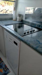 a kitchen counter with a stove top on it at Boat Sirio in San Miguel de Abona