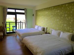 Krevet ili kreveti u jedinici u okviru objekta Tian Nian B&B