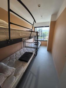 a room with two bunk beds and a window at Central Hostel in Athens