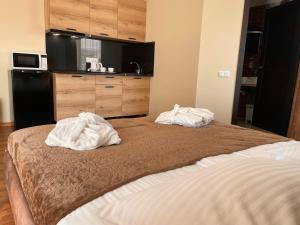 Postel nebo postele na pokoji v ubytování SPA&Hotel MŪSA PARADISE