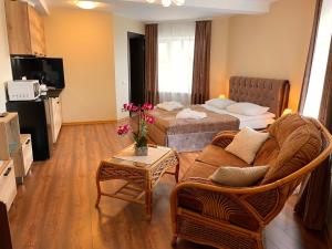 Postel nebo postele na pokoji v ubytování SPA&Hotel MŪSA PARADISE