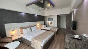 Postel nebo postele na pokoji v ubytování MOX Hotel Wellness & Spa