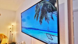 Telewizja i/lub zestaw kina domowego w obiekcie Le SMART - Parking - Terrasse - Wifi - Mulhouse - Relax BNB
