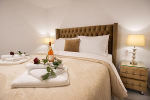 a bedroom with a large bed with two pillows at Villa Virginia, heated pool, Kalamaki in Kalamaki Heraklion +37 photos