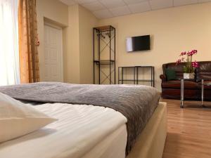 Postel nebo postele na pokoji v ubytování SPA&Hotel MŪSA PARADISE
