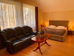 Postel nebo postele na pokoji v ubytování SPA&Hotel MŪSA PARADISE