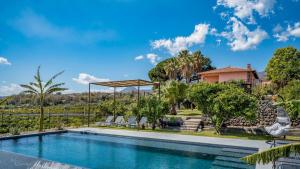 The swimming pool at or close to AGRUME' COUNTRY HOUSE 8, Emma Villas