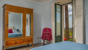 A bed or beds in a room at AGRUME' COUNTRY HOUSE 8, Emma Villas