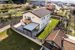 an aerial view of a house on the water at Apartments Mirela in Koper