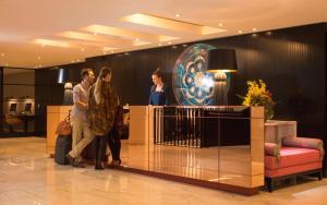 a group of people standing in a lobby at Mayfair Hotel in Adelaide