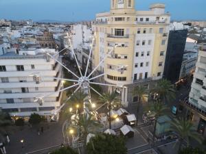 a large ferris wheel in a city at night at New York Style Luxury 3 dormitorios in Jerez de la Frontera +29 photos