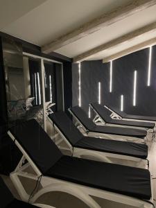 a row of chairs in a room with lights at BAYKA - SPA resort in Kosiv