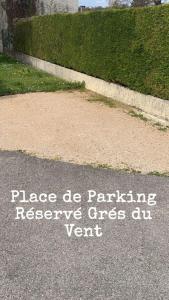 a sign on the road that says please be parking preserve once au vent at Au Grés du Vent in Ruy